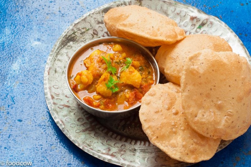 Aloo Tamatar Sabzi - North indian Potato curry made in the pressure cooker,served with Pooris and Kachories during festivals and fasts.