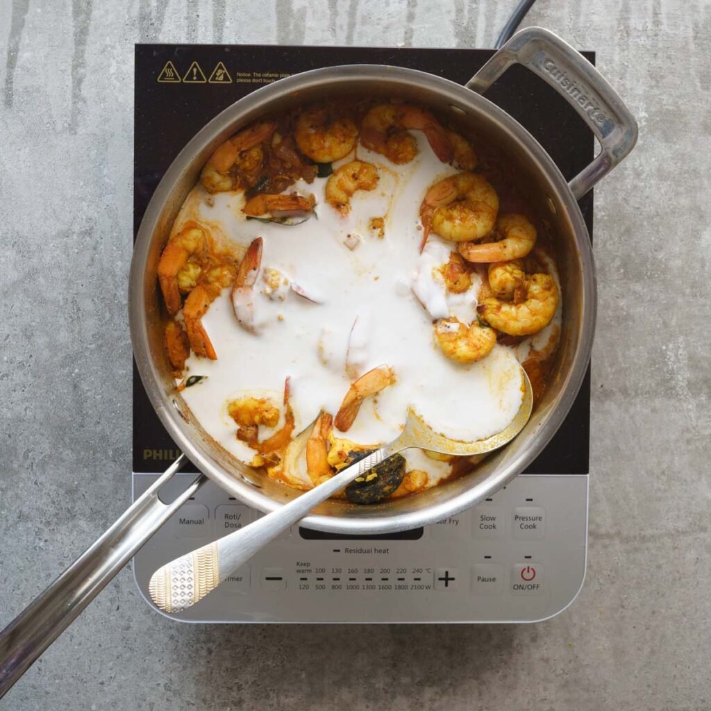 Shrimp with coconut milk in a pan to make shrimp curry