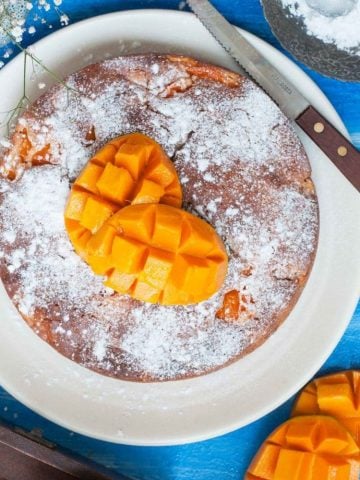 Summertime Eggless Fresh Mango Cake - Basic Eggless Vegetarian Sponge with chunks of Fresh alphonso Mango pieces in it.