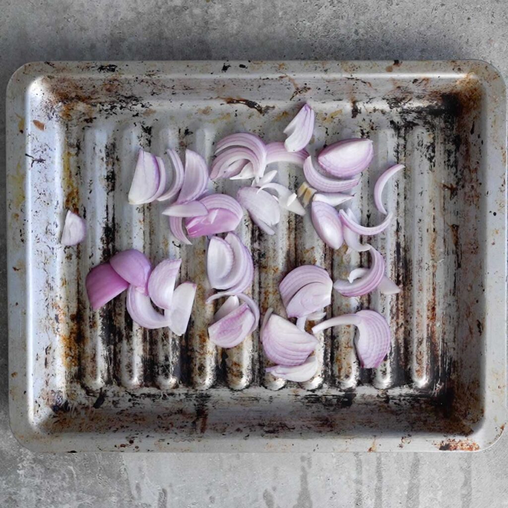 sliced onions in a baking tray