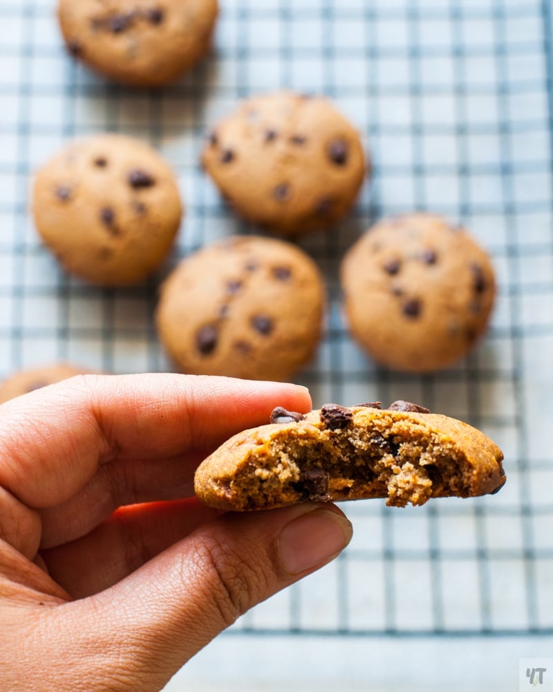 Ragi chocolate Chip cookies on a black cooling rack