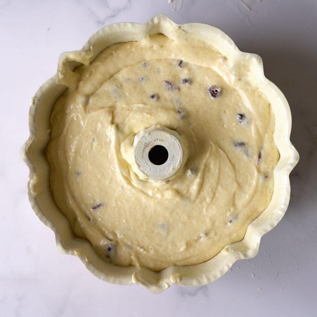 Uncooked lemon Cranberry cake in a 10 inch bundt pan