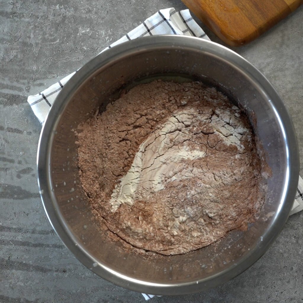 Making the eggless chocolate cake batter- Step 3 - Mixing the wet ingredients and dry ingredients