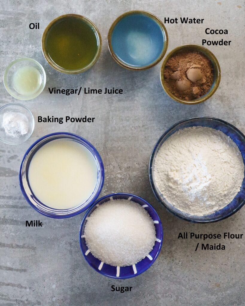 Ingredients for Eggless Chocolate Cake- Maida or all purpose flour, sugar, milk, baking powder, oil, milk, cocoa powder , vinegar or lime juice