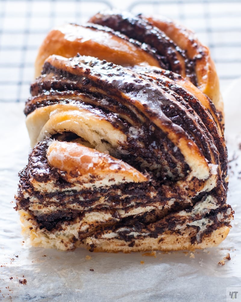 Chocolate Babka - Jewish enriched bread, sliced, on top of a cooling rack