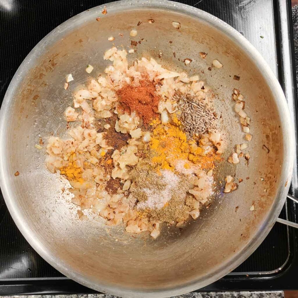 sauted onions with spices in a pan