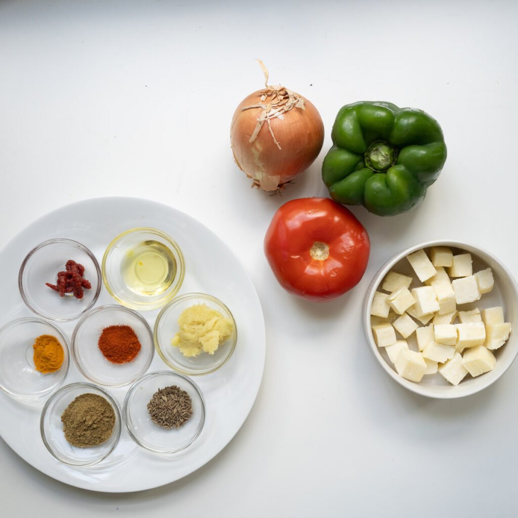 Ingredients needed to make paneer capsicum sabzi