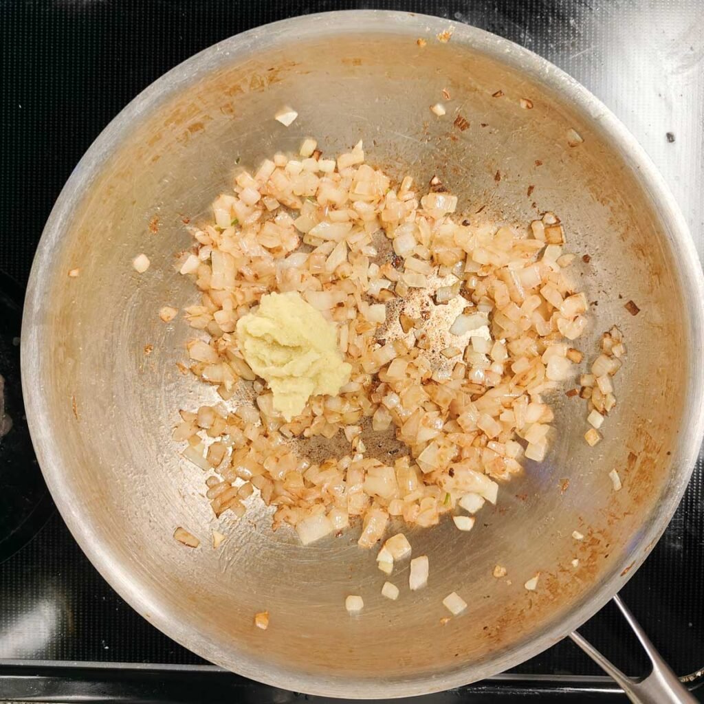 sauted onions with ginger garlic paste in a pan