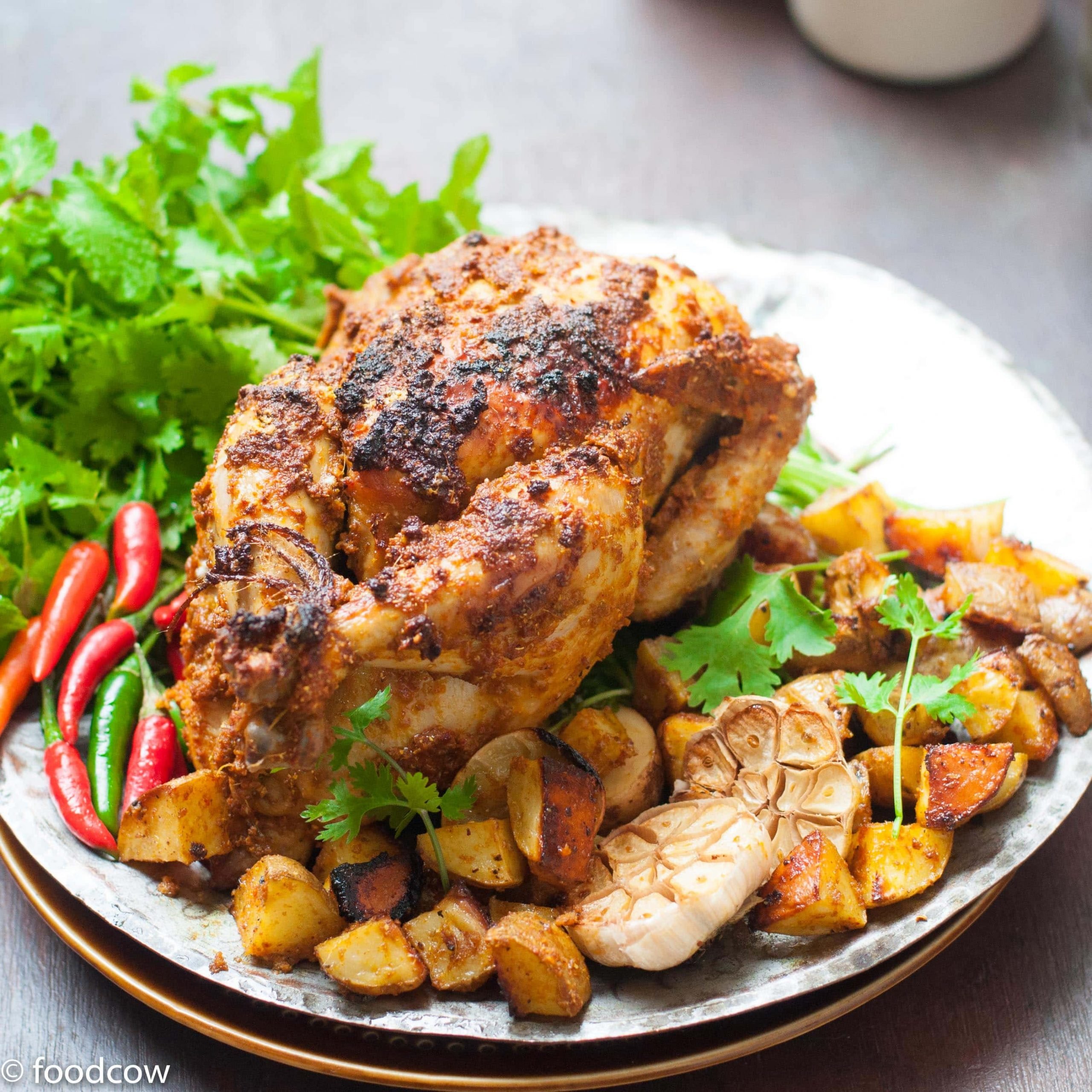 Easy Indian Style Chicken Roast Recipe - Whole Chicken & potatoes roasted with desi indian spices ,yogurt and Ghee.