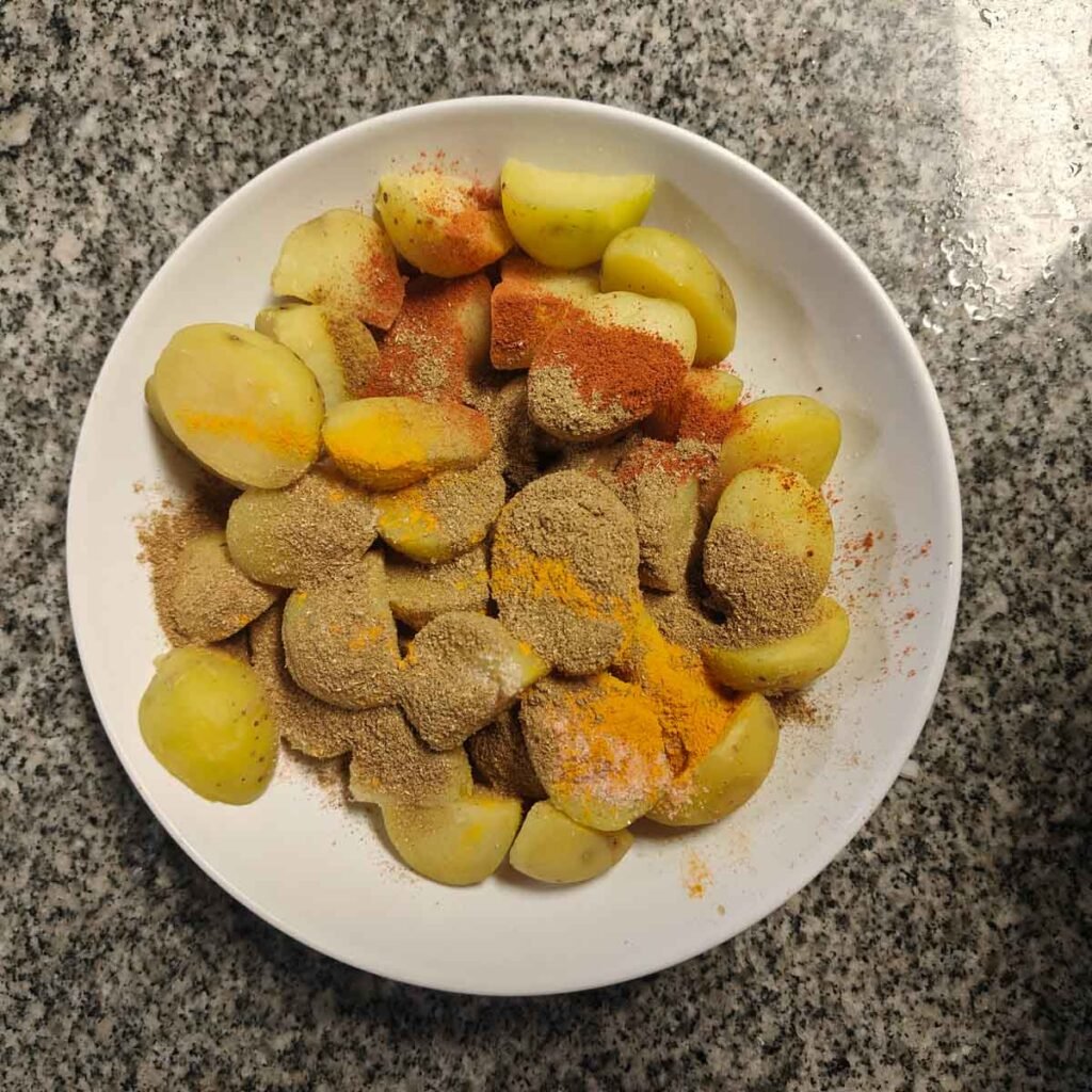 boiled peeled potatoes with spices