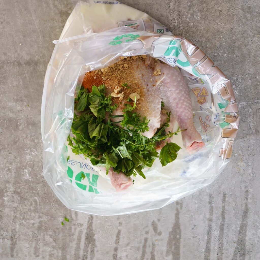 Whole Chicken being brined inside buttermilk to make roast chicken