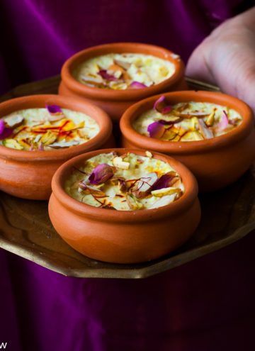 Kesar Phirni Recipe - Creamy Indian Rice Pudding infused with Saffron and cardamom - served chilled with slivered almonds and Pistachios.
