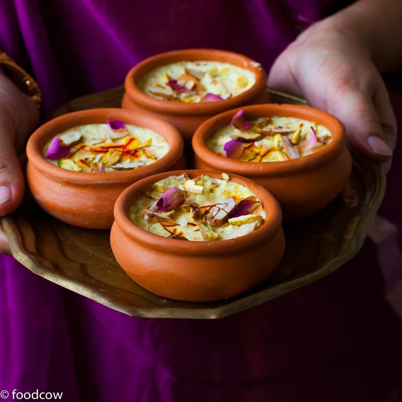 Kesar Phirni Recipe - Creamy Indian Rice Pudding infused with Saffron and cardamom - served chilled with slivered almonds and Pistachios.