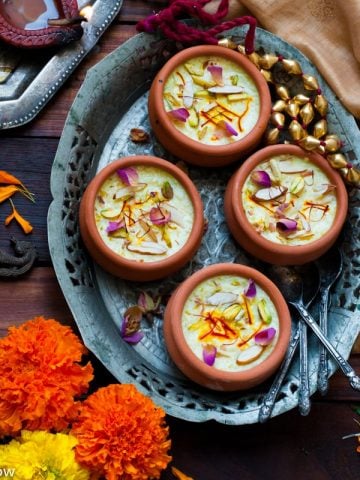 Kesar Phirni Recipe - Creamy Indian Rice Pudding infused with Saffron and cardamom - served chilled with slivered almonds and Pistachios.