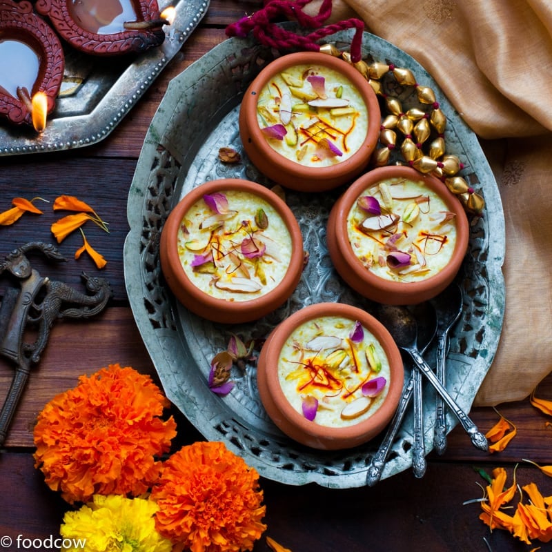 Kesar Phirni Recipe - Creamy Indian Rice Pudding infused with Saffron and cardamom - served chilled with slivered almonds and Pistachios.