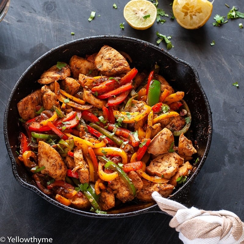 Healthy Fajita Chicken with Bell Peppers - Whole 30 and Paleo approved Chicken cooked in homemade Fajita Seasoning with red,yellow and Green Bell peppers.