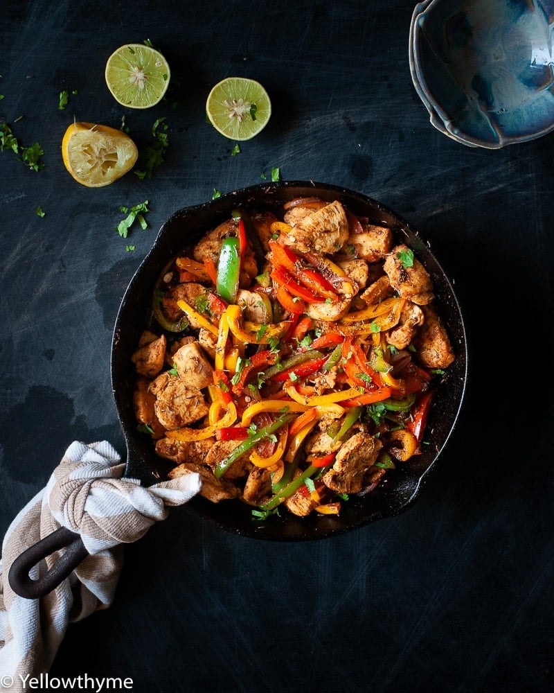 Healthy Fajita Chicken with Bell Peppers - Whole 30 and Paleo approved Chicken cooked in homemade Fajita Seasoning with red,yellow and Green Bell peppers.