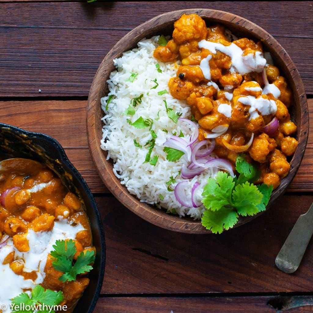 Pumpkin Chickpea Curry in a brown bowl with rice