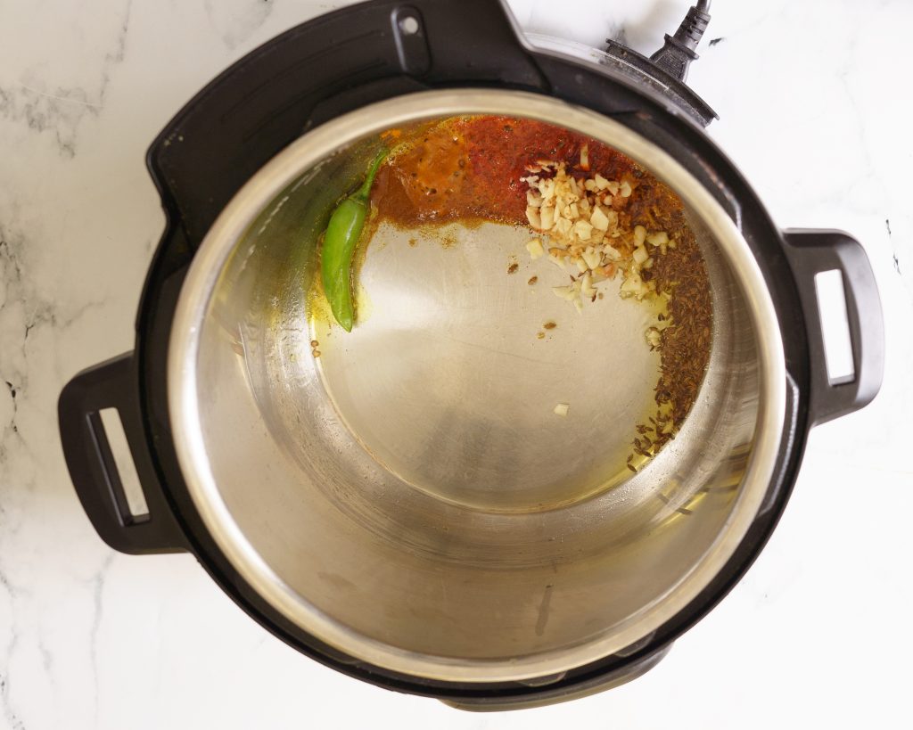 tempering in the pressure cooker to make khichdi
