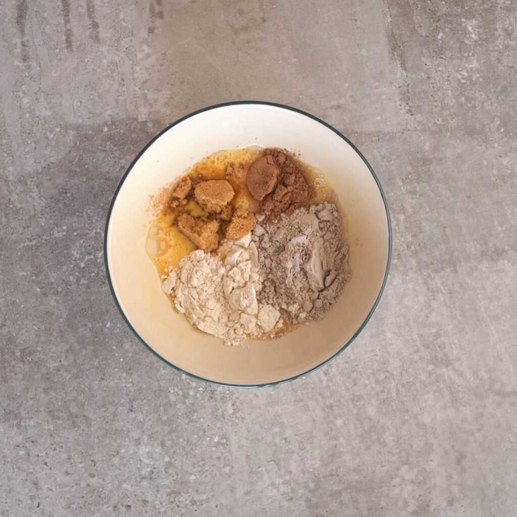 Ragi flour, whole wheat flour, palm sugar and cocoa in a bowl