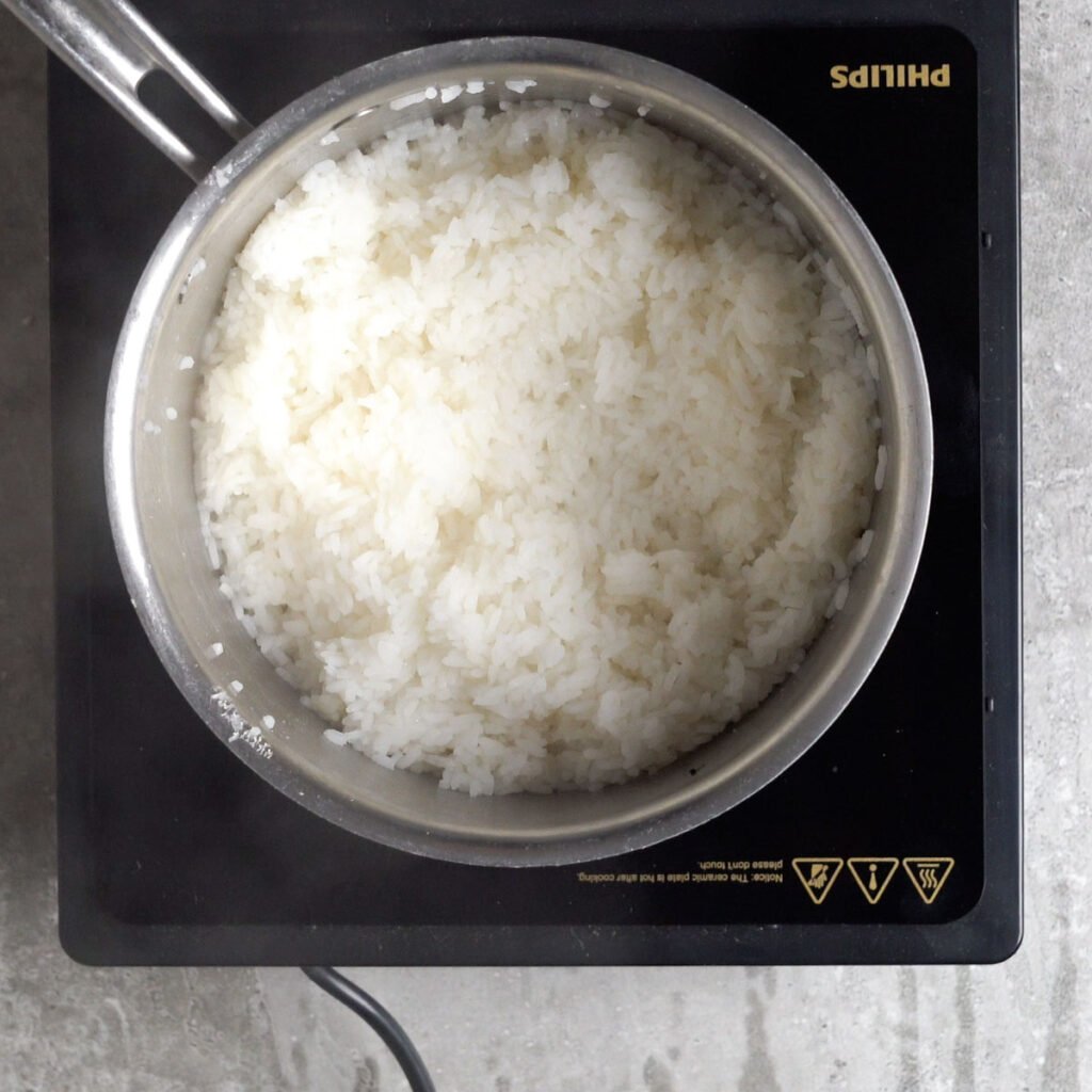 Rice cooked till its soft in a pan