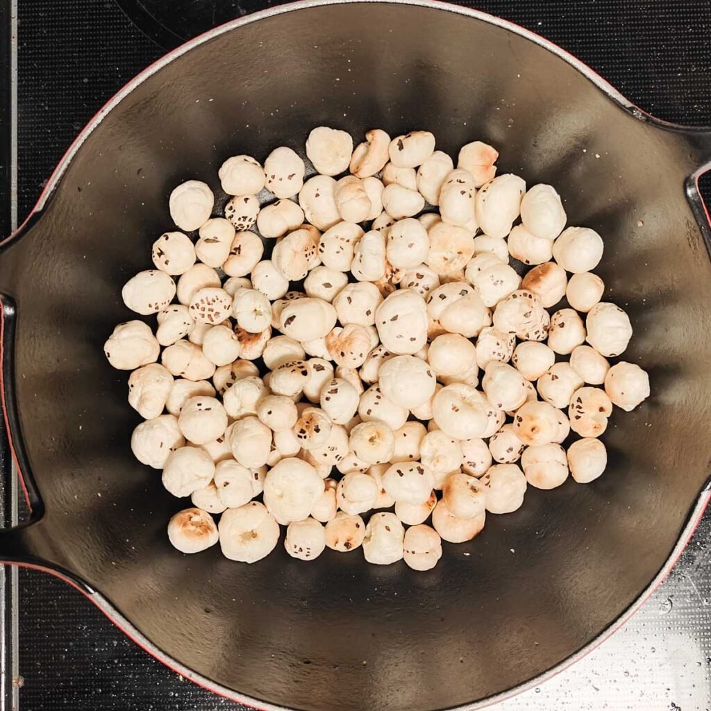 makhana inside a black wok