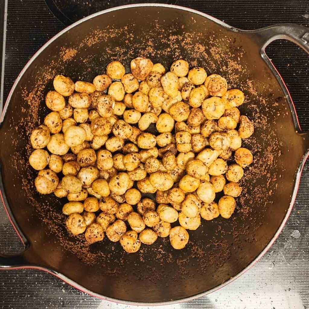 roasted masala makhana in a black wok