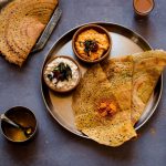Pesarattu - Green Moong Dal dosa made with lentils, green chillies and Garlic.This is a great Vegan, Gluten Free & low carb indian breakfast dish.