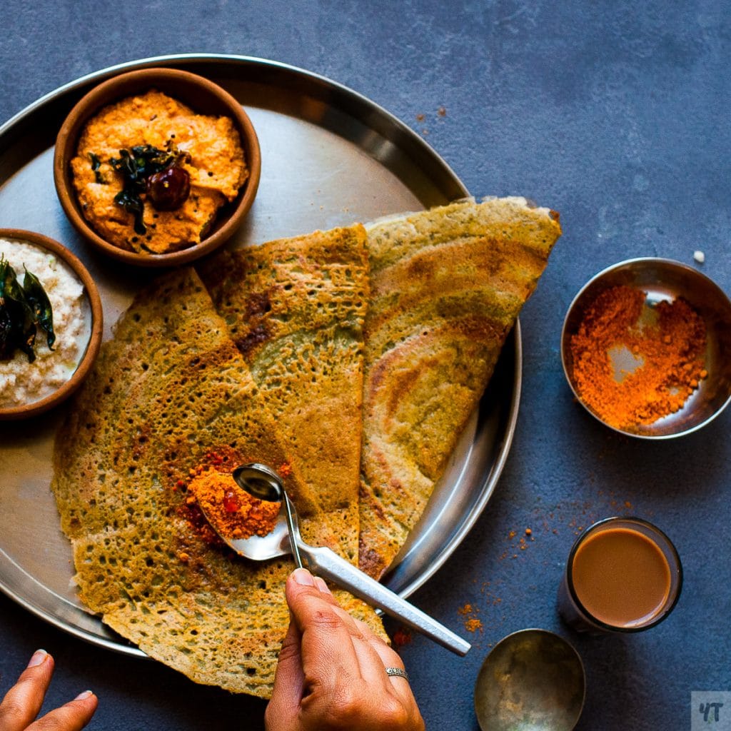 Pesarattu - Green Moong Dal dosa made with lentils, green chillies and Garlic.This is a great Vegan, Gluten Free & low carb indian breakfast dish.