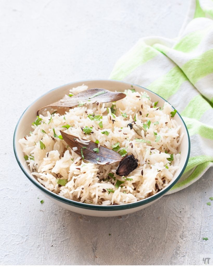 How to make Jeera Rice in Instant Pot without soaking.Perfectly made Indian cumin spiced rice recipe which goes with any curry! #rice #indianrecipe #instantpotrecipe #indianricerecipe #jeerarice #cuminrice #gheerice