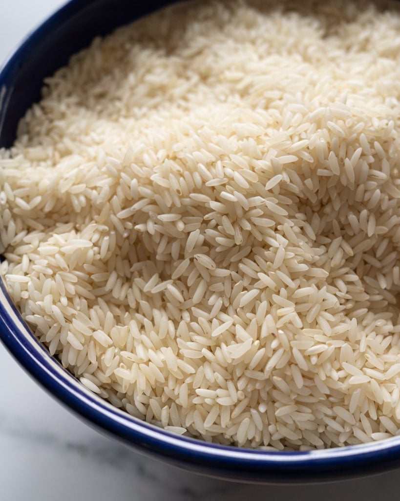 close up of sona masoori rice in a blue bowl