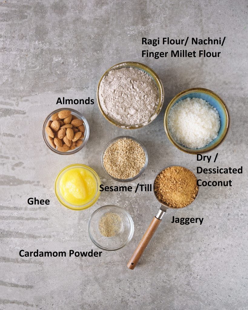 ingredients for making ragi laddu- Ragi flour, almonds, coconut, jaggery, sesame, ghee, cardamom powder