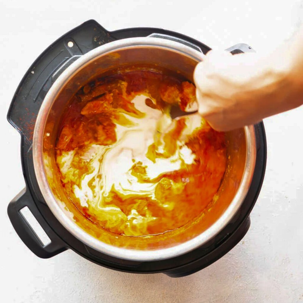 adding cream to pressure cooked butter chicken