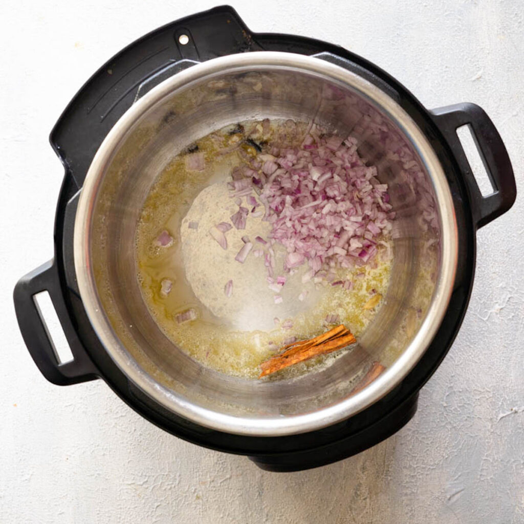 onion, butter, spicies-  cinnamon, cloves and cardamom in the instant pot