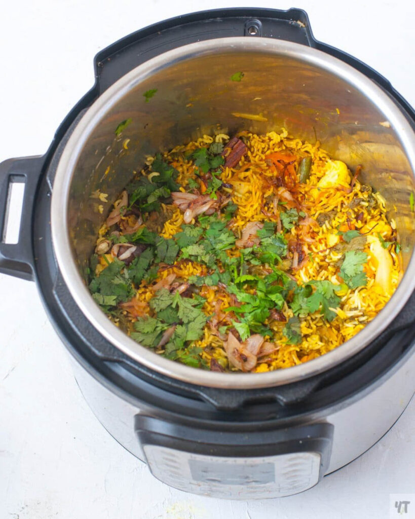 Instant Pot mixed vegetable biryani in the instant pot with cilantro