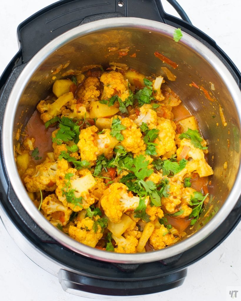 Aloo Gobi in instant pot top view.Potatoes and cauliflower in instant pot.