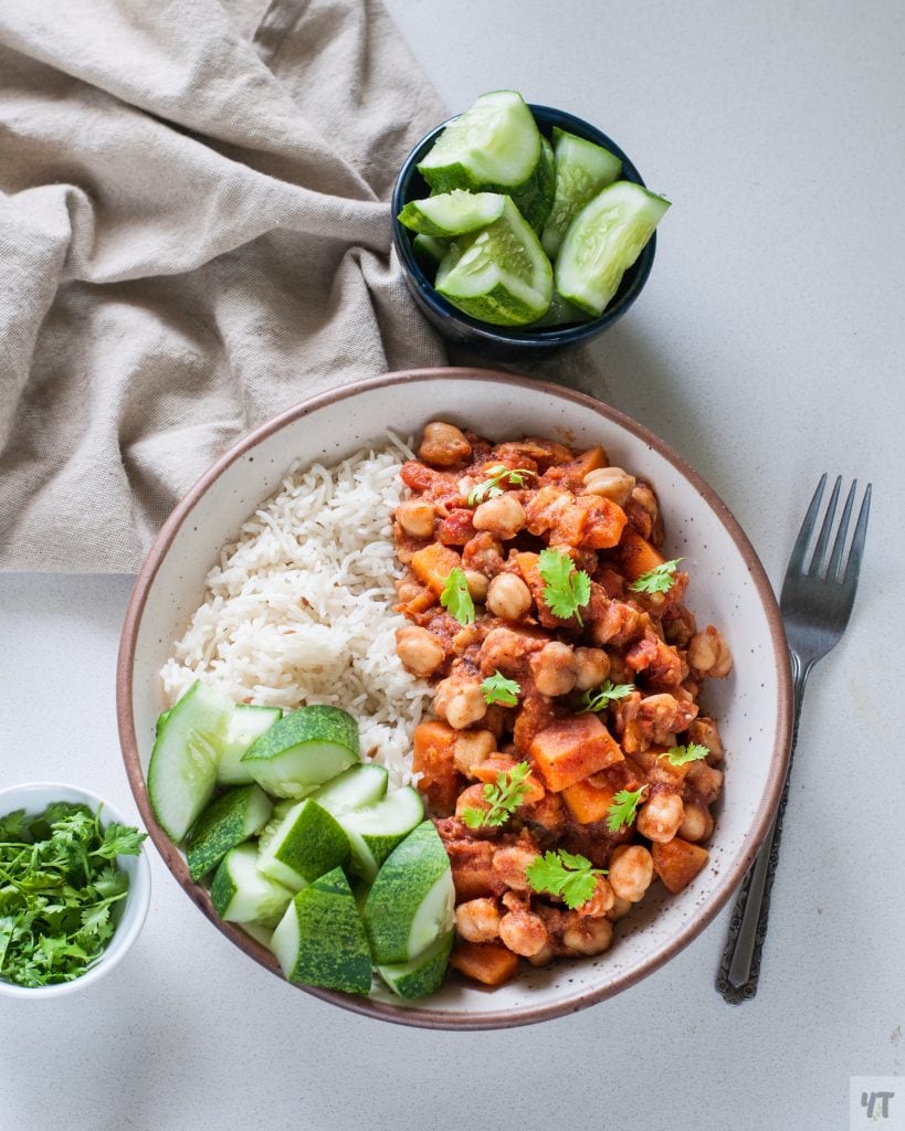 Instant Pot Moroccan Chickpea Stew in a white bowl with rice and cucumber