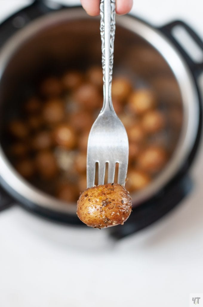 Instant Pot Roast Potatoes  in a fork