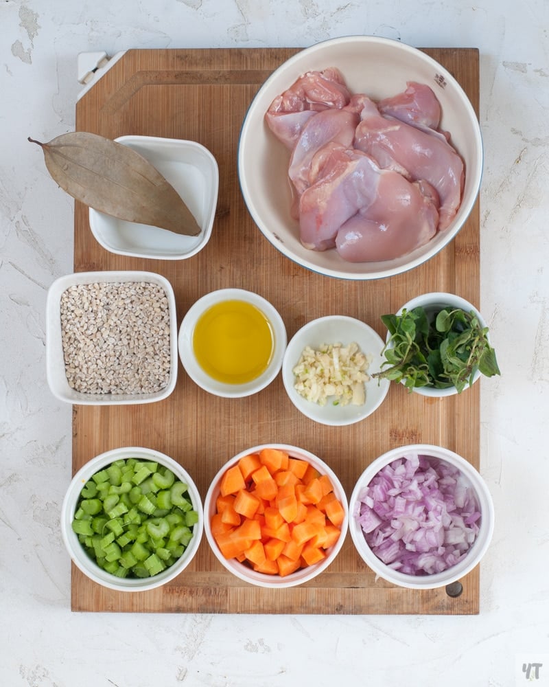 Ingredients for Instant Pot Chicken Barley Soup on a cutting board