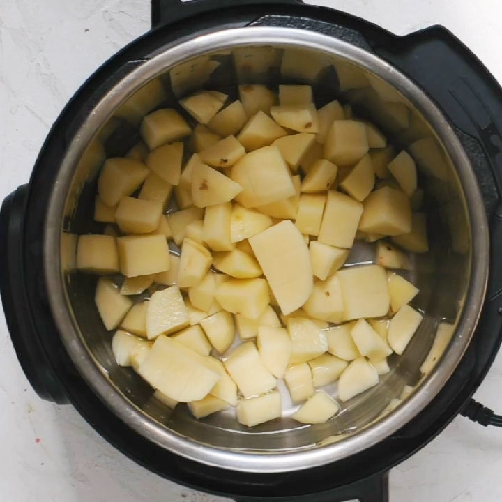 Making Instant Pot Mashed potatoes No drain method - step 1; Add peeled and cubed potatoes