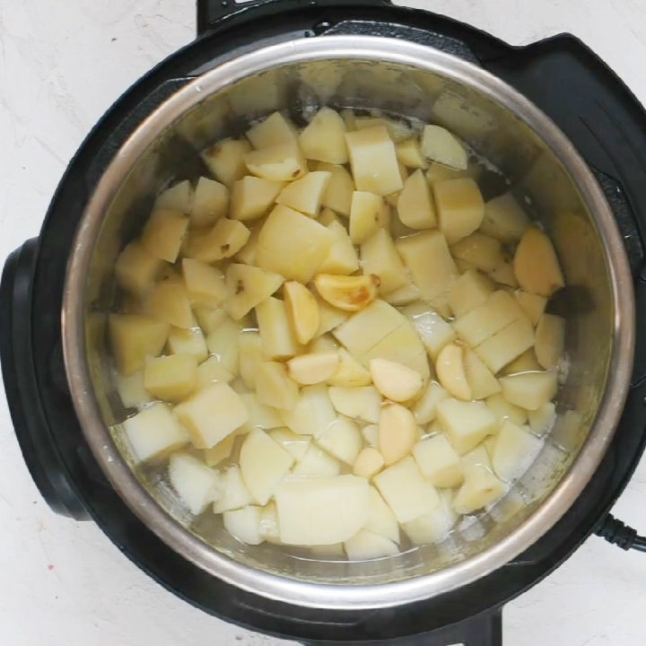 Pressure Cooked Potatoes, garlic and water to make no drain mashed potatoes in the instant pot