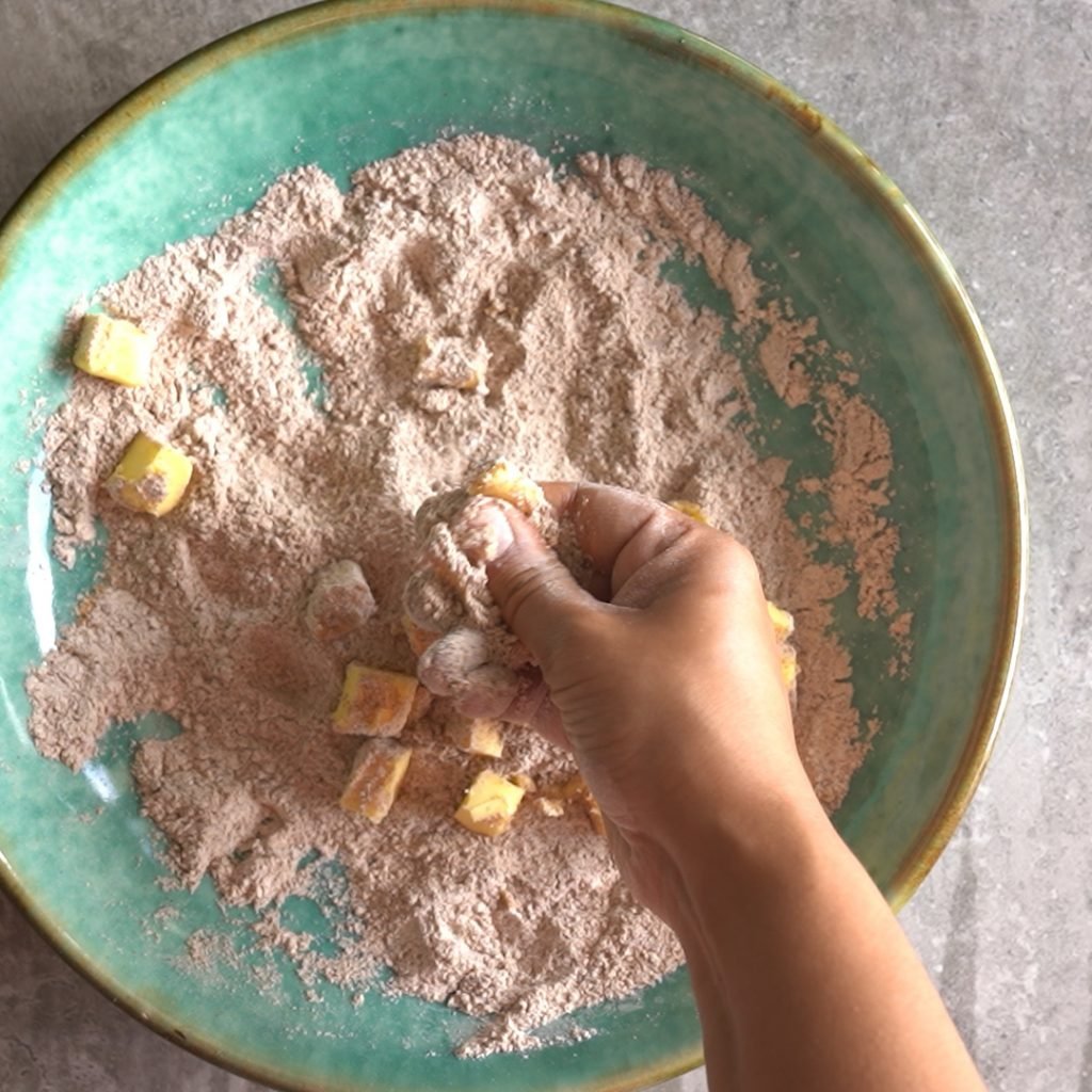 Pinching butter to make Ragi cookies