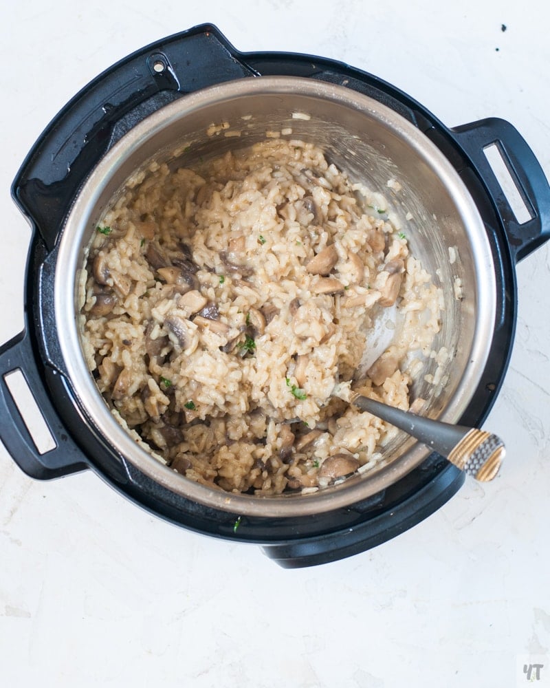 Mushroom Risotto in the instant pot with a ladle