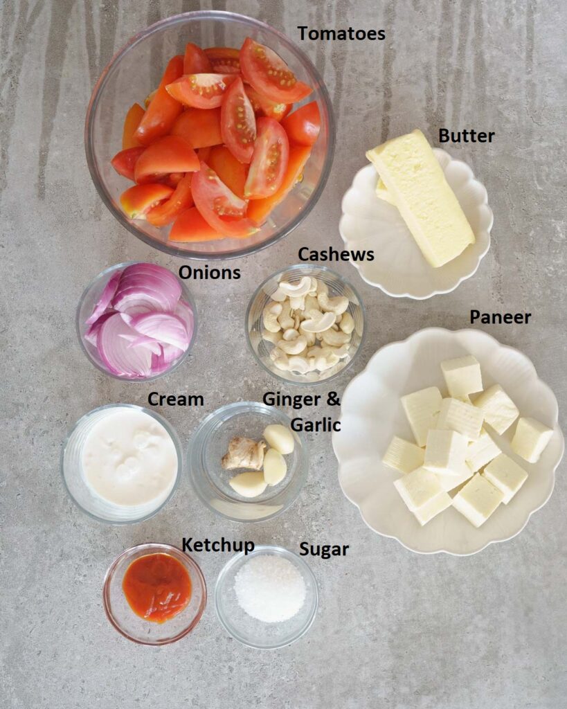 ingredients needed to make paneer butter masala in the pressure cooker.
Paneer
Onion
Tomato
Cashews
Sugar
Ketchup
Spices