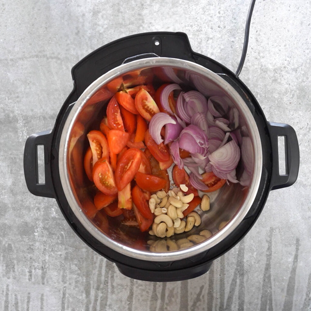 tomatoes, onions and cashews in instant pot
