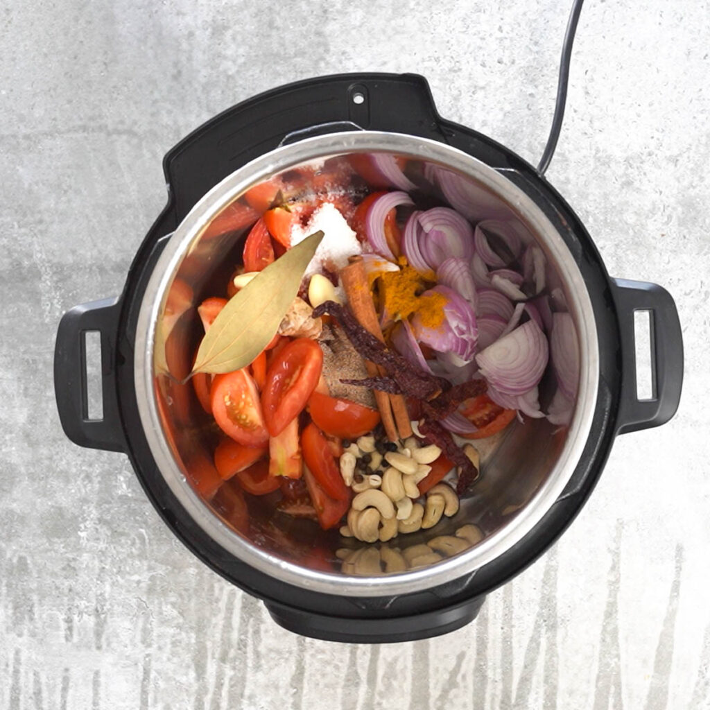 tomatoes, onions,spices and cashews in instant pot