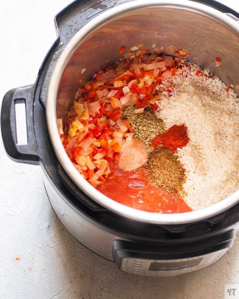 rice, tomato passata, onion, red bell pepper , cumin and oregano in the instant pot