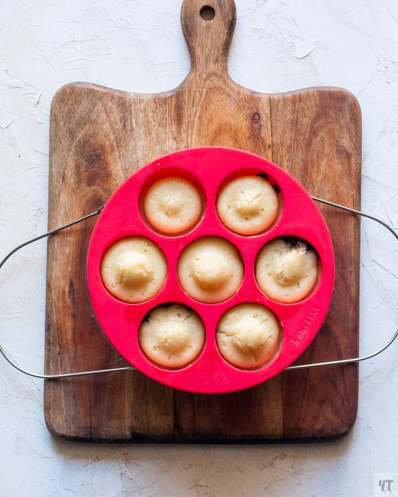 Pancake bites in red instant pot egg bite mold on top of a trivet.