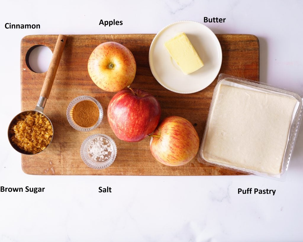 ingredient photo to make apple turnover in the air fryer - brown sugar,apples,salt, cinammon, butter and puff pastry