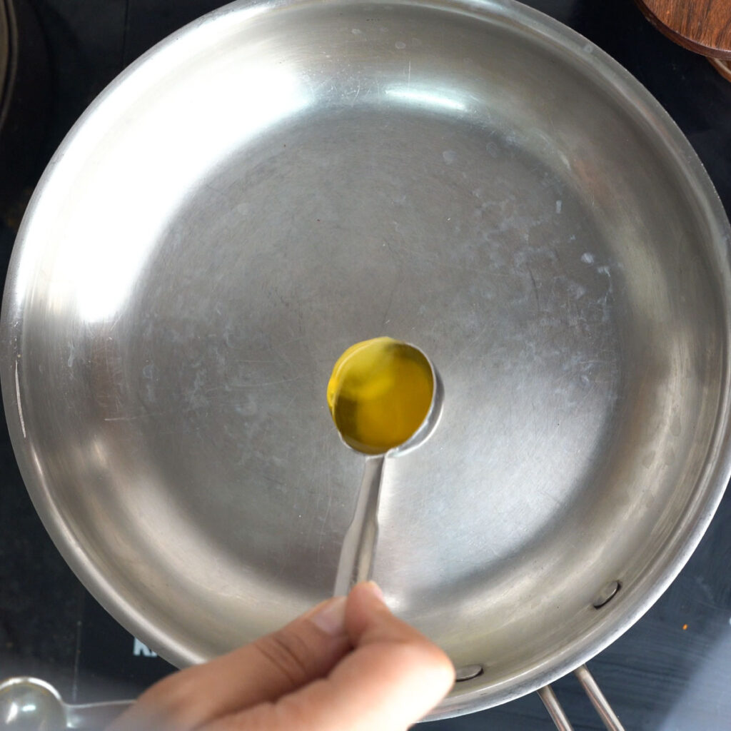 Adding Ghee to a flat steel pan